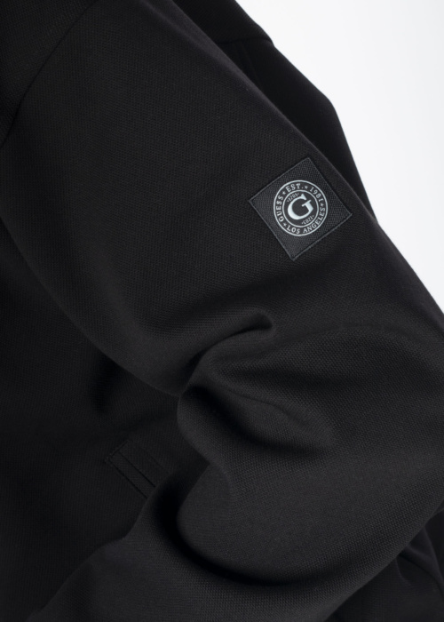 Guess pavasario-rudens striukė Logotipas